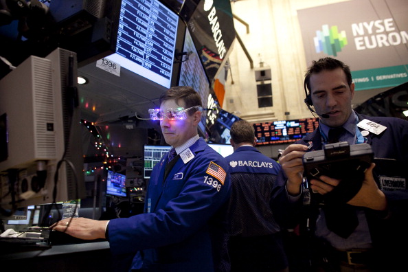 Traders work on the floor of the New York Stock Exchange December 31, 2012, New York