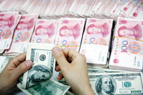 The yuan devalued slightly against the US dollar earlier in the year after the central bank started to implement financial reforms [Xinhua]
