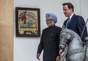 Cameron, right, urged Delhi to continue to open India's markets to foreign investment [Getty Images]