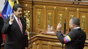 Holding the Venezuelan Constitution in his right hand, Maduro is sworn in as president [AP]