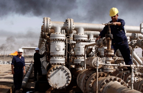 The increase of oil output in Iraq (above) and the expected return of Iran to the market will contribute to price instability, the International Energy Agency says [AP]