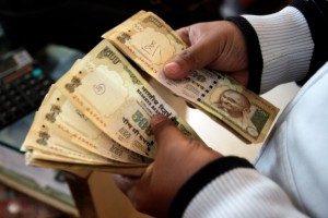 India is trying to woo foreign investors back after capital flight and currency devaluation [AP]