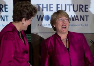 Brazil's President Dilma Rousseff, left, and Chile's former President and new Chilean President Michelle Bachelet share a laugh in this file photo [AP]