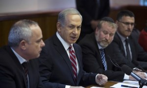 Israel's prime minister Binyamin Netanyahu (second left) at a cabinet meeting on Sunday [AP]