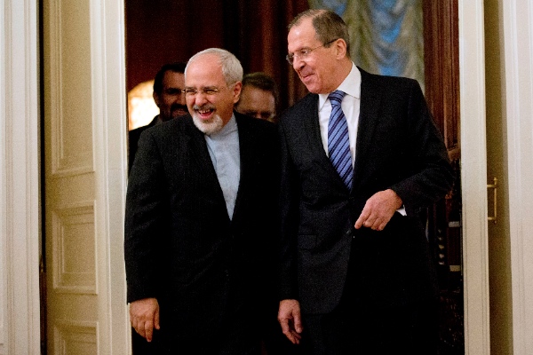 Russian Foreign Minister Sergey Lavrov, right, and his Iranian counterpart Mohammad Javad Zarif walk for their meeting at the Foreign Ministry mansion in Moscow, Russia, Thursday, Jan. 16, 2014 [AP]