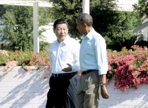 Chinese President Xi Jinping (L) and US President Barack Obama have solidified economic ties, but regional pressures threaten that relationship [Xinhua]