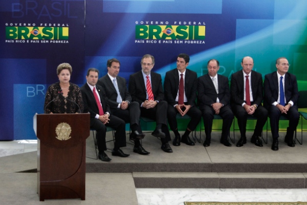 Brazil's President Dilma Rousseff, standing left, speaks during a ceremony held to present six new ministers to her cabinet, at the Planalto Presidential Palace, in Brasilia, Brazil, Monday, March 17, 2014 [AP]