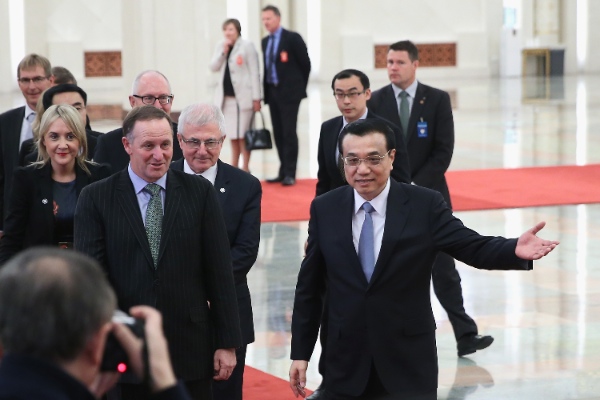 Chinese Premier Li Keqiang, right, shows the way for New Zealand's Prime Minister John Key, the Great Hall of the People in Beijing, China, Tuesday, March 18, 2014 [AP]