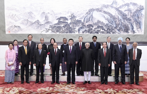 Chinese President Xi Jinping, Myanmar President U Thein Sein and Indian Vice President Mohammad Hamid Ansari together with delegates from China, India and Myanmar attending a conference marking the 60th anniversary of the Five Principles of Peaceful Coexistence pose for a group picture during their meeting in Beijing, capital of China, June 28, 2014 [Xinhua]