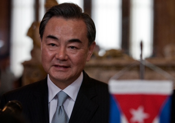 China's Foreign Minister Wang Yi smiles during a meeting with Cuba's Foreign Minister Bruno Rodriguez at the Foreign Ministry in Havana, Cuba, Sunday, April 20, 2014 [AP]
