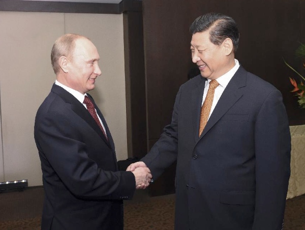 Xi met “ally and friend” Putin on the sidelines of the 6th BRICS Summit in Fortaleza on 14 July 2014 [Xinhua]