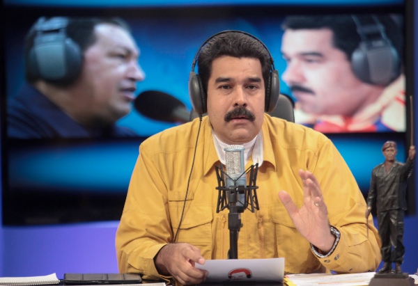 Venezuela's President Nicolas Maduro takes part in his radio program "En Contacto con Maduro", in the Miraflores Palace, in Caracas, Venezuela, on July 15, 2014 [Xinhua]