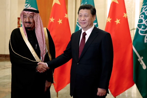 Chinese President Xi Jinping, right, shakes hands with Saudi Prince Salman bin Abdul-Aziz as they pose for photos at the Great Hall of the People in Beijing, China, Thursday, March 13, 2014 [AP]