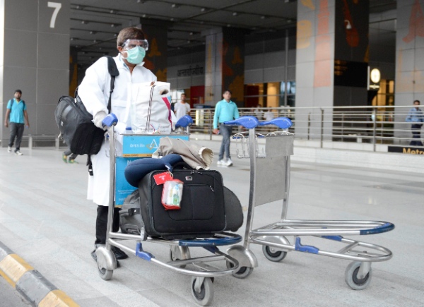 A passenger, who did not pass the preliminary screening for the Ebola virus, leaves the Delhi International Airport to Ram Manohar Lohia Hospital for further medical checkup on Aug. 26, 2014 [Xinhua]