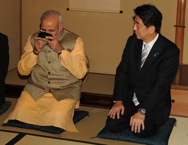Indian Prime Minister Narendra Modi (left) with his Japanese counterpart Shinzo Abe at a traditional tea ceremony in Tokyo, Japan on August 2014 [Image: PMO, India]