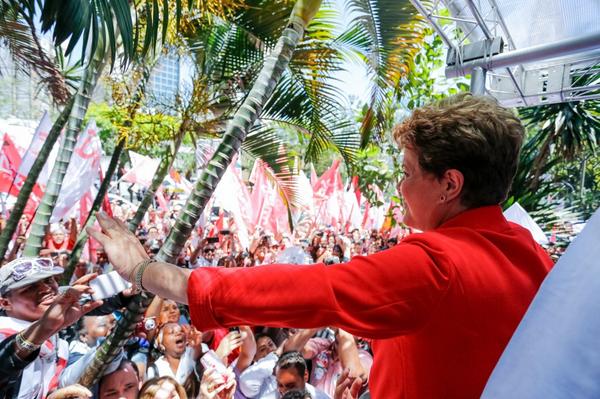 New polls out on Saturday afternoon show the race to meet incumbent Dilma Rousseff (seen here, waving to supporters on Saturday) in a second round will be hotly contested [Image: gov.br]