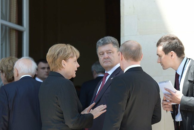 File photo of Putin with German Chancellor Angela Merkel and Ukrainian President Petro Poroshenko [PPIO]