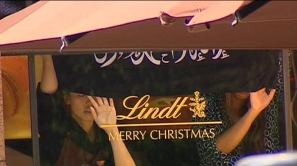TV grab of hostages at the Sydney cafe on 15 December 2014 [Image: Australian Seven channel]