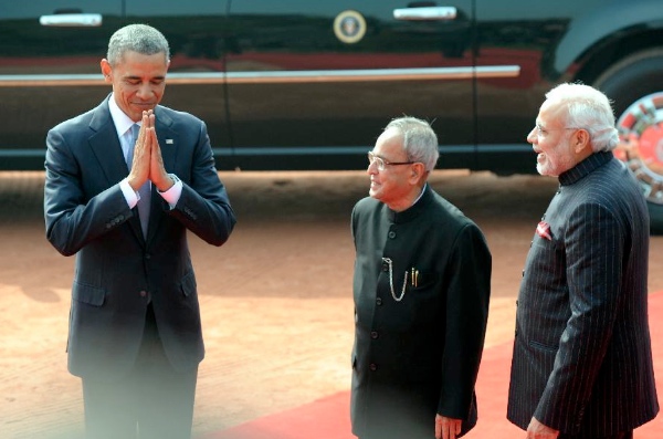 US President Barack Obama does a Namaste, a traditional Indian greeting, flanked by Indian President Pranab Mukherjee (center) and Indian Prime Minister Narendra Modi in New Delhi on 25 January 2015 [Xinhua]