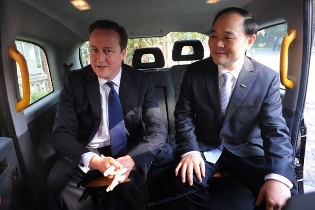 UK Prime Minister David Cameron with Geely Chairman Li Shufu. The maker of London’s iconic black taxis has been saved from closure after Chinese car maker Geely bought out the company for $17.2 million [Xinhua] 