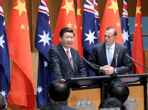 File photo Chinese President Xi Jinping (L) and Australian Prime Minister Tony Abbott meet the press in Canberra, capital of Australia, Nov. 17, 2014 [Xinhua]