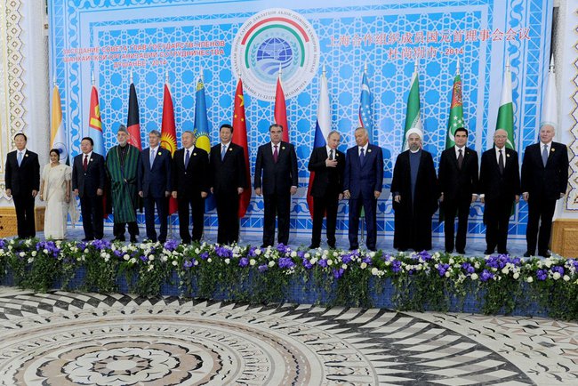 Participants, including Russian President Vladimir Putin (6th from right), Chinese President Xi Jinping (7th from left, Iranian President Hassan Rouhani (4th from right) at the SCO Council of Heads of State meeting on 12 September 2014 in Dushanbe, Tajikistan [PPIO]