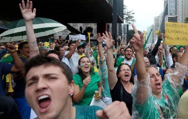Demonstrators shout slogans during a protest against the government of the Brazilian President Dilma Rousseff, in Sao Paulo, Brazil, on March 15, 2015 [Xinhua]