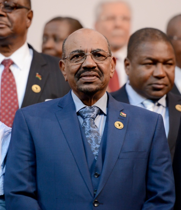 Sudanese President Omar al-Bashir gestures during the photocall before the opening of the 25th African Union (AU) Summit at Sandton Convention Center in Johannesburg, South Africa, on June 14, 2015. Sudanese President Omar al-Bashir attends the 25th AU Summit here despite the International Criminal Court's arrest warrants  [Xinhua]