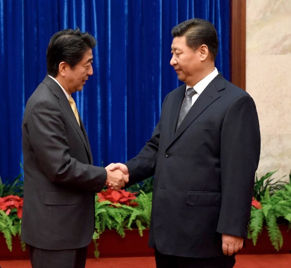 Chinese President Xi Jinping (R) and Japanese Prime Minister Shinzo Abe have meet several times in recent years, often on the sideline of global summits, but their territorial disputes over the East China Sea have strained ties [Xinhua]