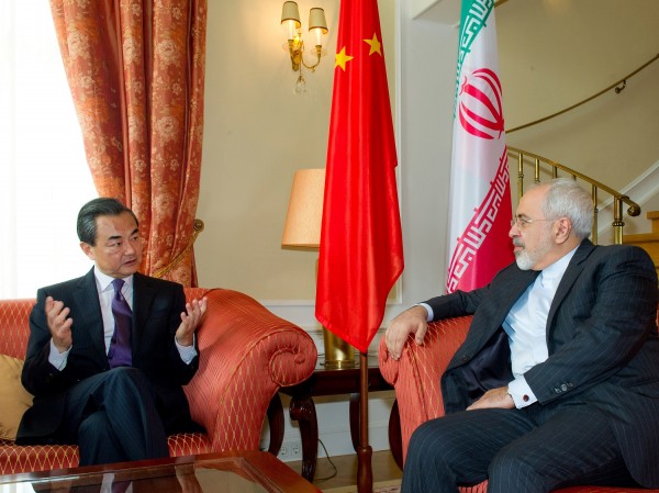 Chinese Foreign Minister Wang Yi meets with his Iranian counterpart Javad Zarif in Vienna. China has supported a lifting of an arms embargo [Xinhua]