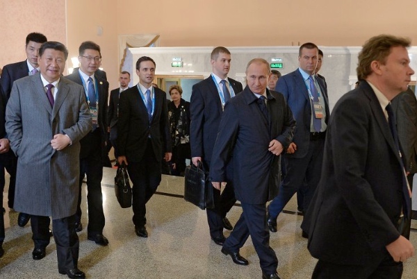 President of the Russian Federation Vladimir Putin, third right, and President of the People’s Republic of China Xi Jinping, left, at a formal reception hosted by President of the Russian Federation Vladimir Putin in honour of the participants in the BRICS Summit and the SCO Heads of State Council Meeting on 9 July 2015 [Image: brics2015.ru]