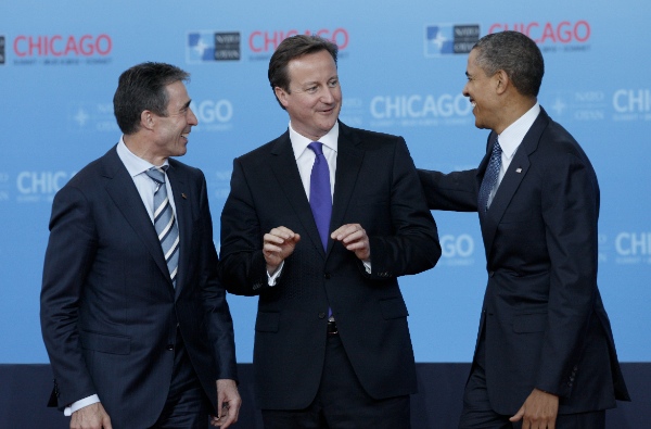 File photo: U.S. President Barack Obama (R) and NATO Secretary-General Anders Fogh Rasmussen (L) welcome British Prime Minister David Cameron on his arrival to the NATO Summit [Xinhua]