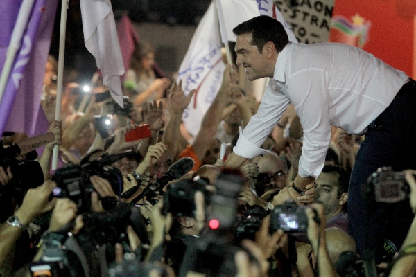 Greece's former Prime Minister Alexis Tsipras, also the leader of left-wing Syriza party, greets his supporters after the election results at the party's main electoral center in Athens, Greece, Sept. 20, 2015 [Xinhua]