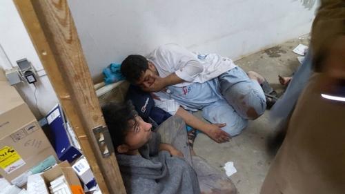 MSF staff in shock in one of the remaining parts of MSF's hospital in Kunduz, in the aftermath of sustained bombing 03 October 2015 [Image: MSF]