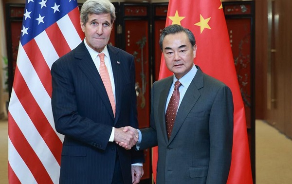 Chinese Foreign Minister Wang Yi (R) shakes hands with U.S. Secretary of State John Kerry in Beijing, capital of China, Jan. 27, 2016 [Xinhua]