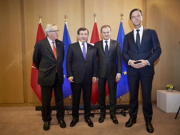 European leaders are hoping to convince Davutoglu, center, to repatriate tens of thousands of Syrian refugees crossing into Greece beginning next week [Xinhua]
