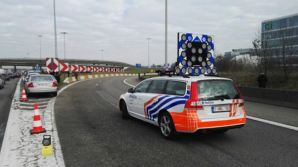 A police car blocks the road to Brussels Internatinal Airport in Brussels, Belgium, on March 22, 2016 [Xinhua]