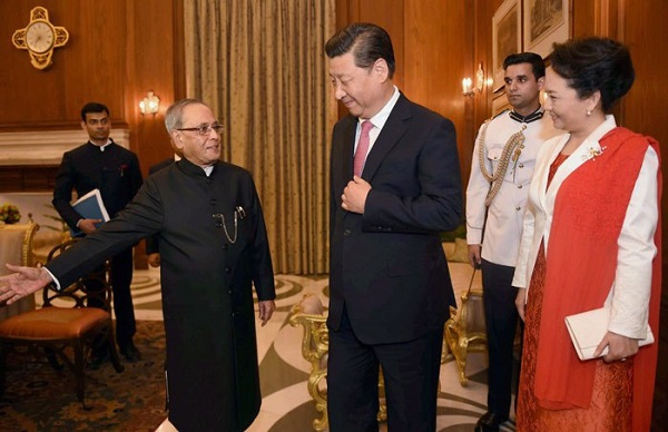 File Photo: Indian President Pranab Mukherjee (left) with China's President Xi Jinping and his wife Peng Liyuan at the Presidential Palace (Rashtrapati Bhawan) in New Delhi, India [Image: Indian President's office]